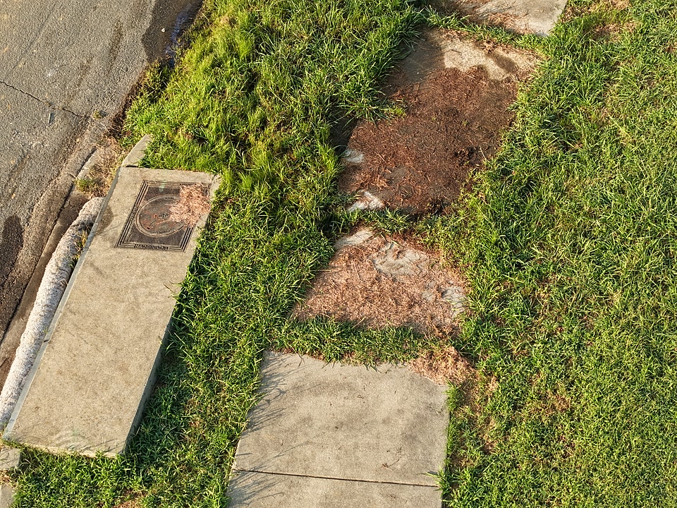 Close-up of existing pavement cracking documented before construction began